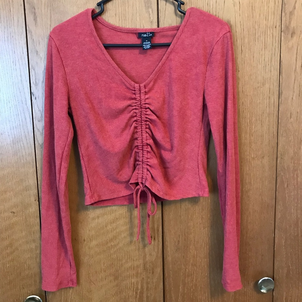 Brunt red orange scrunched shirt.